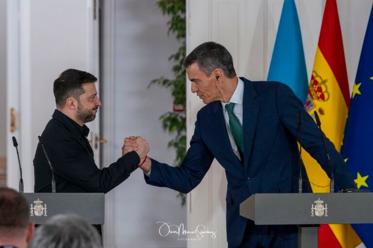 Ukrainian President VOLODYMYR ZELENSKY (left) and Spanish Prime Minister PEDRO SANCHEZ (right) shake hands at a press conference